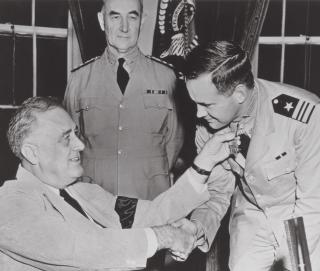Lieutenant Commander John D. Bulkeley receives the Medal of Honor from President Franklin D. Roosevelt for exploits during the early days of World War II.