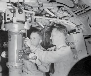 Commander Edward L. Beach (left) on duty on board the USS Amberjack. Beach commanded the Amberjack after a tour in the Navy’s Atomic Defense Section in the Pentagon.