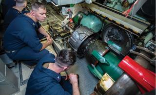Sailors inspect a Mk 48 Advanced Capability torpedo on board the fast-attack submarine USS Chicago (SSN-721). The Navy should experiment with training in which learning is paired with additional opportunities to exercise autonomy and do creative work.