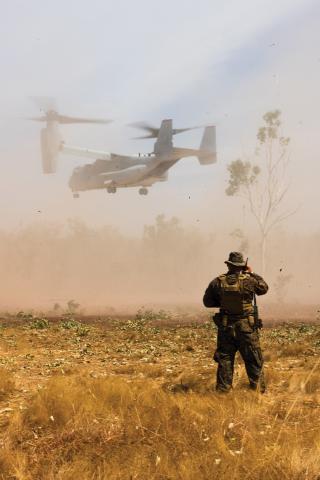 A Marine with Marine Air Control Group 38, Marine Rotational Force–Darwin 23, watches an MV-22B Osprey tiltrotor aircraft land at Mount Bundey Training Area, Australia, in May 2023. In support of establishing sea control beyond 2035, the Marine Corps should continue to mature and expand its littoral combat vision.