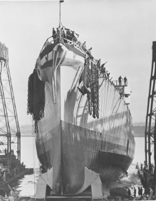 Launching the light cruiser USS Oklahoma City (CL-91) at Cramp Shipbuilding in 1944. World War II accelerated demand for warships and the specialized workers to build them. Cramp president James Reed attempted a training program, but much of his workforce was learning a shipbuilding trade for the first time.