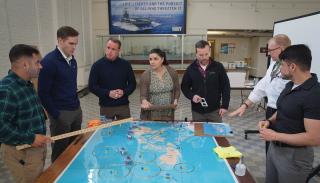 Students and faculty practice complex war scenarios at the U.S. Naval War College War Gaming Department in March 2023. Iterative analytic wargames have helped shape war plans and maritime strategies in the past. 