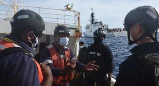 USCGC Munro (WMSL-755) conducts a boarding operation