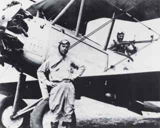 Marine First Lieutenant Christian F. Schilt stands beside his Vought O2U-1 Corsair in January 1928. In this aircraft he made ten flights into Quilali, Nicaragua, carrying a total of 1,400 pounds of medicine and supplies. Eighteen wounded were flown to Ocotal, some of whom would not have survived otherwise. Schilt would receive the Medal of Honor for his actions.