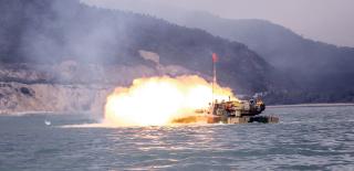 A Chinese Type 05 amphibious tank in a live-fire exercise in the South China Sea. While the U.S. joint force has moved toward smaller, distributed teams and lightly armored infantry, China has worked to integrate MPF into its amphibious assaults.
