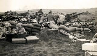 Marine artillerymen entrenched on Iwo Jima, c. February–March 1945.