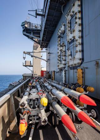 Ordnance waits on the flight deck of the Dwight D. Eisenhower. The carrier strike group has expended more than 80 air-to-air missiles, 350 air-to-surface weapons, and 100 Standard and Tomahawk missiles since arriving in the Middle East.