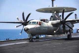 An E-2C Hawkeye attached to Airborne Command and Control Squadron 123 launches from the Dwight D. Eisenhower’s flight deck. The Hawkeyes provide the carrier strike group command and control in support of dynamic targeting.