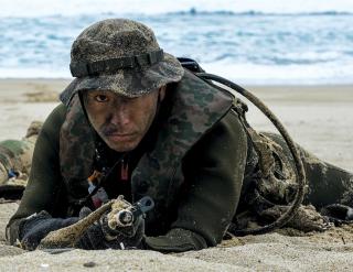 A Japan Ground Self-Defense Force soldier posts security during a bilateral amphibious assault exercise at Tokunoshima, Japan. The JSDF is undergoing an extensive qualitative upgrade to its power-projection capabilities, but these changes are primarily intended to bolster the JSDF’s ability to defend Japan, not to project force within the region.