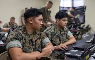 U.S. Marines set up a network connection during integrated littoral warfare center (ILWC) dislocation training in Okinawa. The ILWC is a portable command center that can be established anywhere to conduct and support operations. ILWC staff also can be scaled to operational demand, with the ability to include liaison officers from allies and partners and other U.S. Navy staffs. 