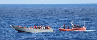 A small boat crew from the USCGC Bear (WMEC-901) interdicts a vessel overloaded with migrants and bound for the United States while underway north of Haiti. The mission is not only to deter unlawful migration, but also to prevent loss of life at sea. 