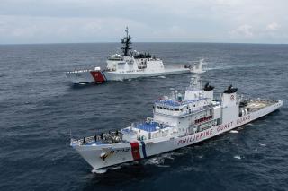 Crew on the USCGC Waesche (WMSL-751) pass honors to the Philippine Coast Guard’s Melchora Aquino during a bilateral search-and-rescue exercise in the South China Sea. The Waesche was the second national security cutter deployed to the Indo-Pacific in 2024. 