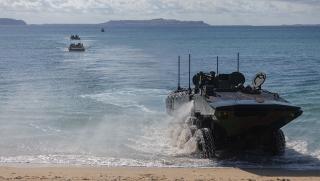 Amphibious Combat Vehicles (ACVs) from III Marine Expeditionary Force land at Kin Blue Beach Training Area, Okinawa, Japan. ACVs were deployed overseas for the first time, after restrictions requiring additional operator training were lifted.