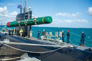 Sailors from the USS Springfield (SSN-761) load a Harpoon inert training shape in 2022. The Navy announced in 2021 that it would begin the process of upgrading Harpoons to deploy them on submarines 24 years after the missiles were withdrawn from service. Until it obtains a new submarine-launched antiship missile, the Navy should accelerate this process. 