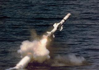 A UGM-84 Harpoon missile breaks the surface during a test launch.