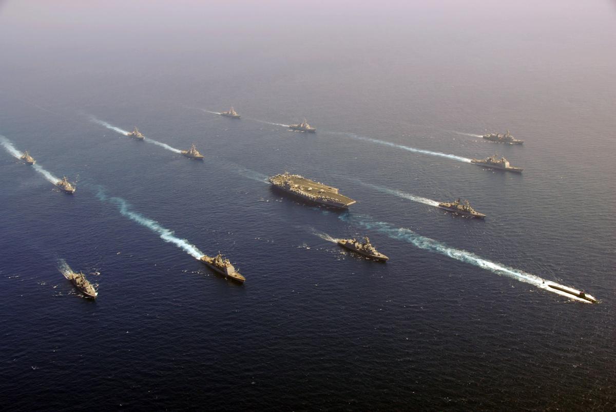 U.S. and Japanese ships transit in formation with the Nimitz-class aircraft carrier USS John C. Stennis (CVN 74), left, after a successful undersea warfare exercise involving the John C. Stennis Carrier Strike Group.