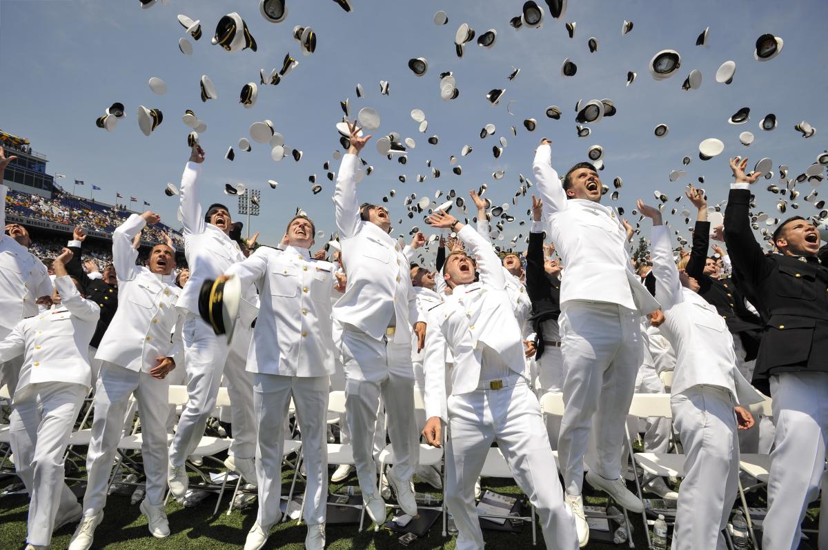 Newly commissioned Navy Ensigns and Marine 2nd Lieutenants from the U.S. Naval Academy Class of 2016 throw their midshipmen covers in the air at the end of their graduation and commissioning ceremony May 27 at the Navy-Marine Corp Memorial Stadium