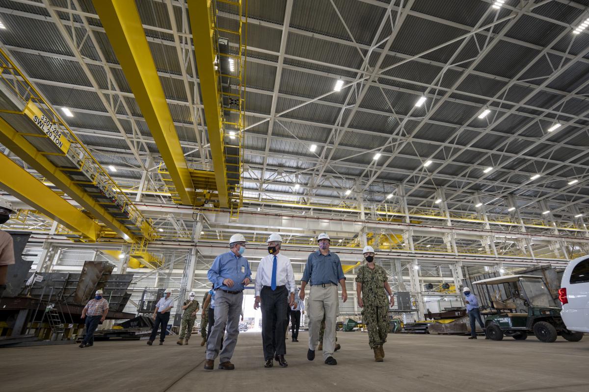 Secretary of the Navy Kenneth Braithwaite tours the Huntington Ingalls Industries shipyard in Pascagoula, Mississippi. The visit was one in a series to discuss industrial base economic wellness—a critical factor should the United States need to mobilize for major conflict.