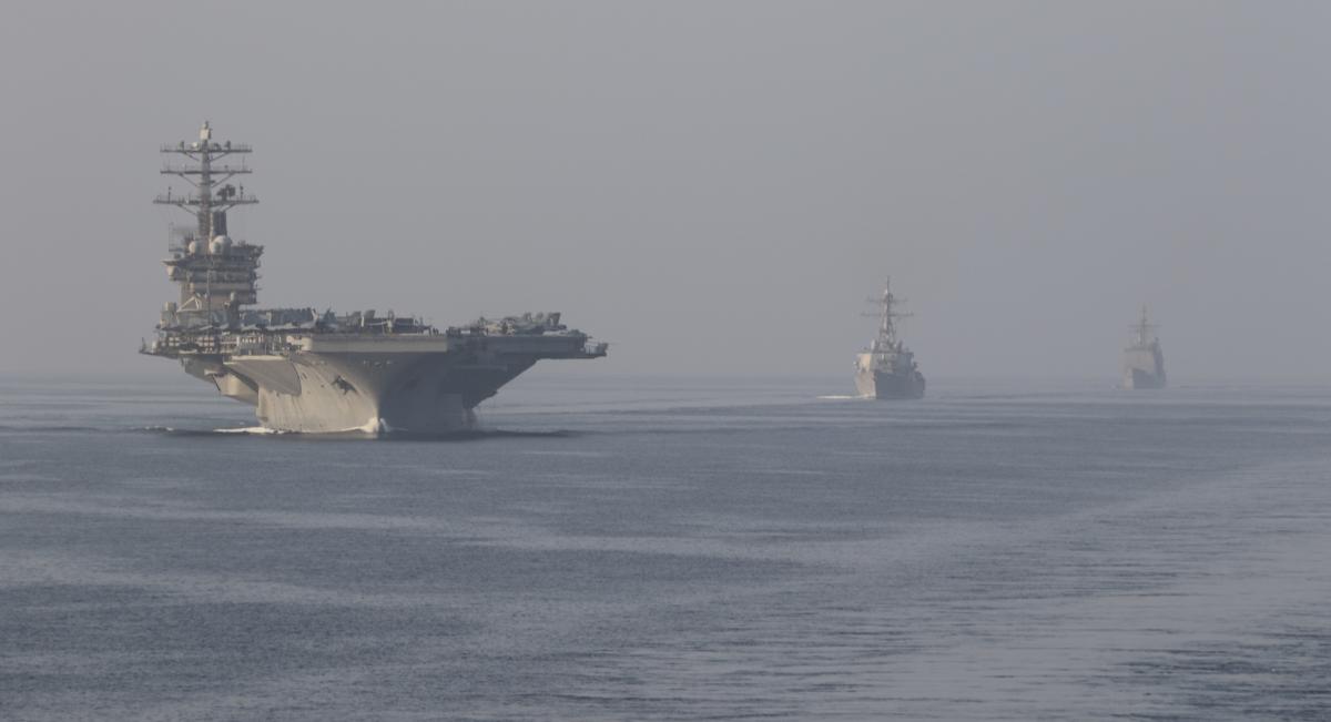 The aircraft carrier USS Nimitz (CVN-68), the guided-missile destroyer John Paul Jones (DDG-53), center, and the guided-missile cruiser Princeton (CG-59), sail in formation during a scheduled transit of the Strait of Hormuz.  Credit: U.S. Navy (Anthony Collier)