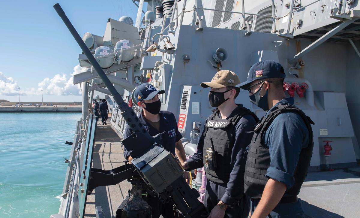 Sailors assigned to the Arleigh Burke–class guided-missile destroyer USS Donald Cook (DDG-75) man the .50-caliber machine gun as the ship gets under way from its homeport of Rota, Spain. From August to December 2019, a total of 11 sailors received mental health services through the Naval Hospital Rota secure video teleconference consultation  (VT-Sea) pilot program.