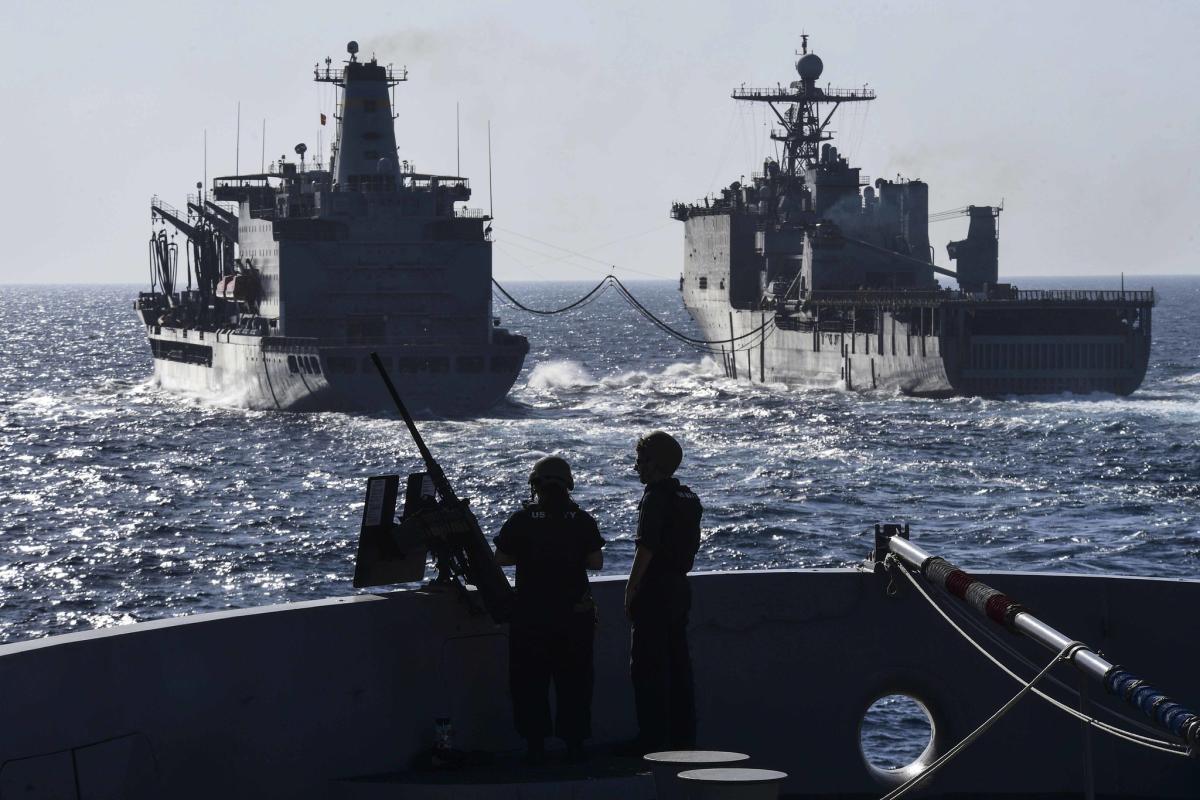 Sailors stand watch on the bow of the USS San Diego.