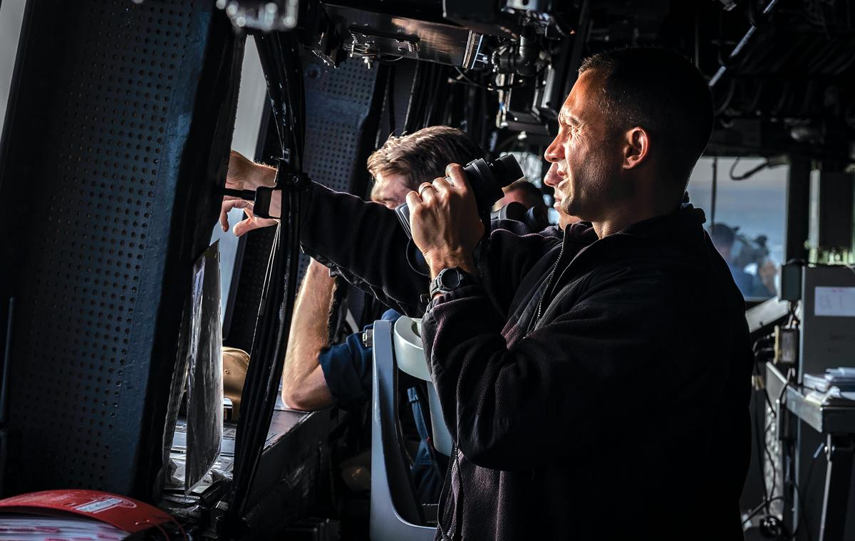 The executive officer of the amphibious transport dock USS Green Bay (LPD-20) scans the horizon during a Taiwan Strait transit. While the Navy has focused on human performance under increased stress, cognitive task analysis could be another tool to model small-team operations and maintenance procedures, identifying probable failure points and mitigations.