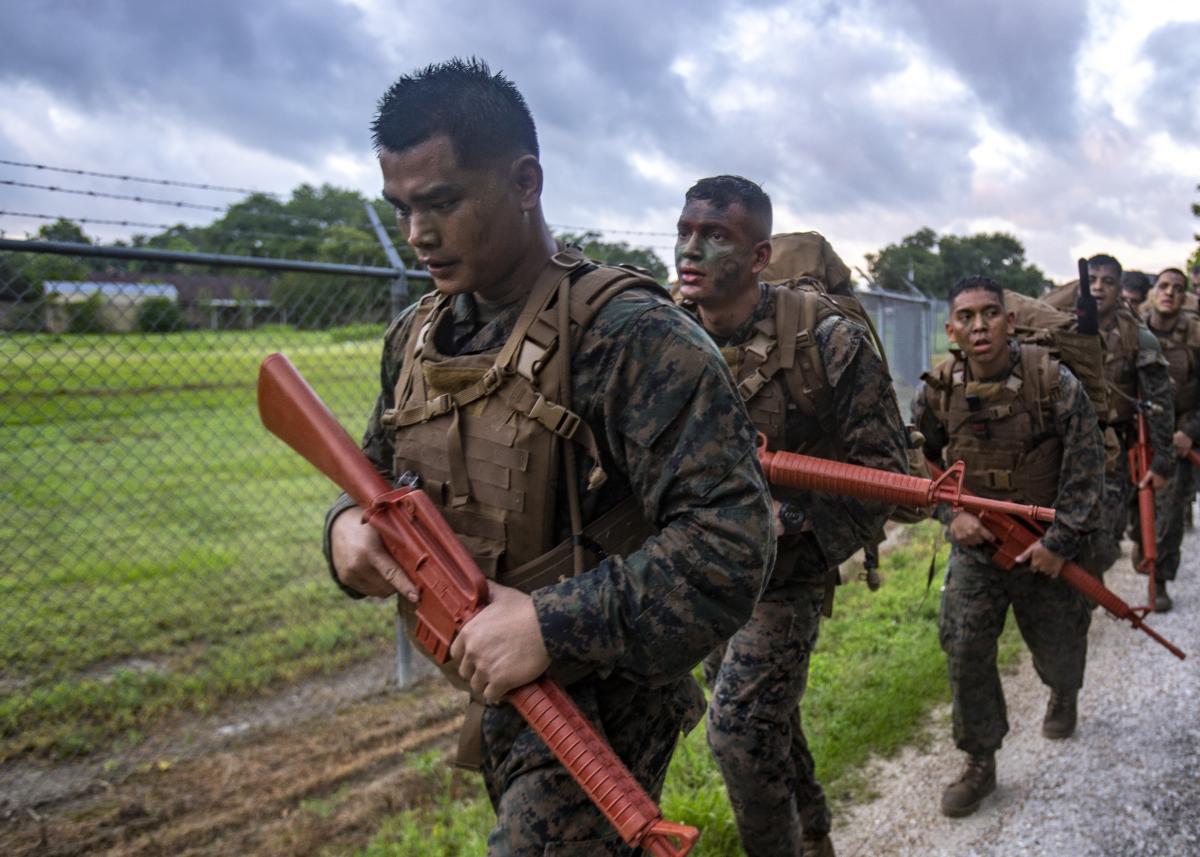 U.S. Marine Corps Reservists hike during a culminating event at Naval Air Station Joint Reserve Base New Orleans on May 23, 2019