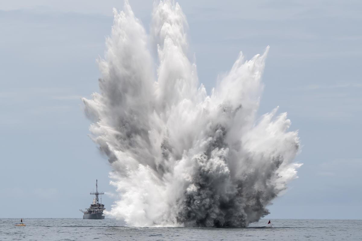 A mine explodes at sea