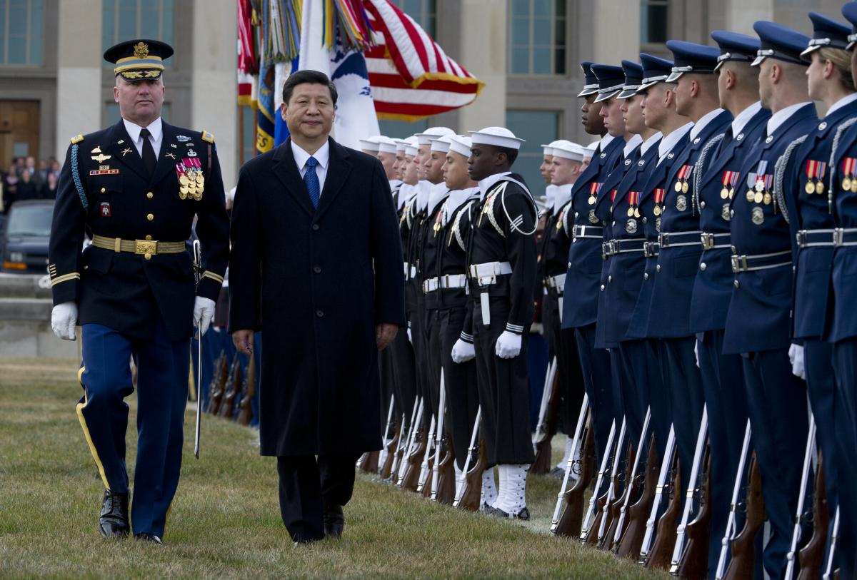 A full honors arrival ceremony welcomes Xi Jinping, center left, to the Pentagon in 2012.