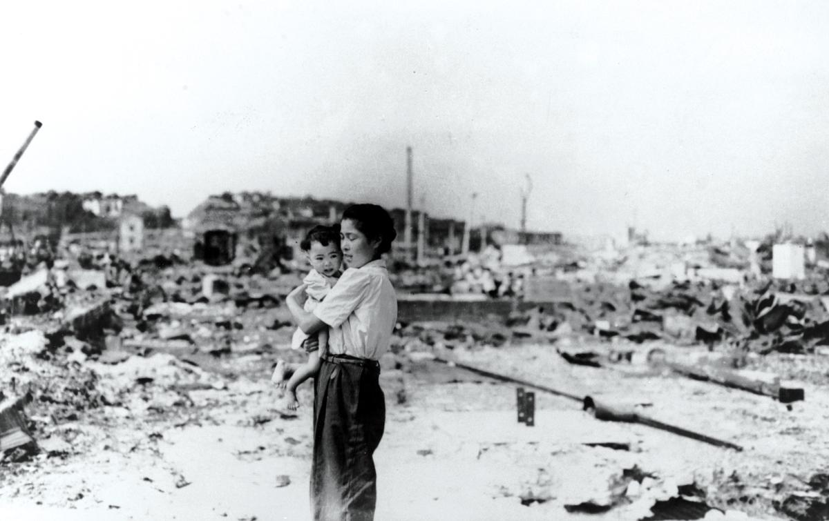 A Japanese woman and child are surrounded by the rubble of a destroyed Tokyo in this September 1945 photo taken by a U.S. sailor. As Quartermaster Michael Bak observed, “We saw nothing but ruins, and how people lived in that ruin is beyond me.”