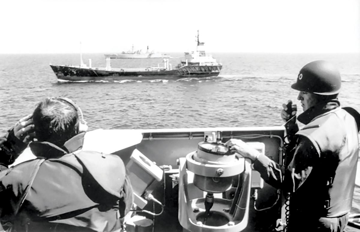 The Royal Australian Navy Adelaide-class guided-missile frigate Darwin intercepts the Iraqi motor vessel Tamdur smuggling prohibited goods in the Gulf of Oman, September 1990.
