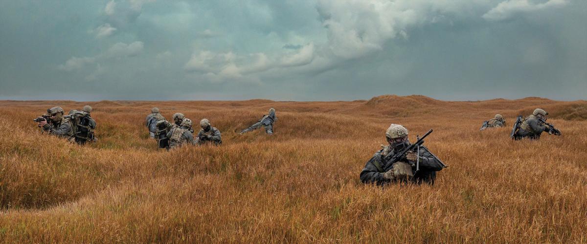 Members of a West Coast–based Naval Special Warfare command set security during an exercise.