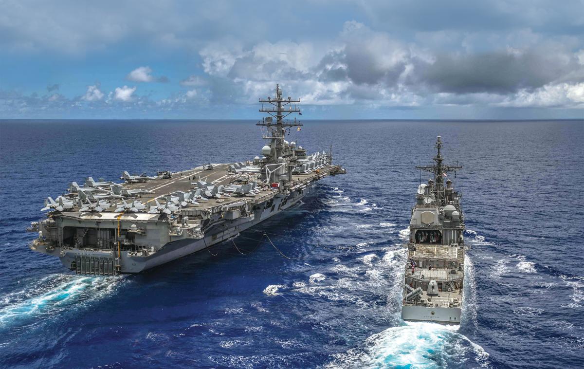 The USS Ronald Reagan (CVN-76) and the USS Antietam (CG-54). 