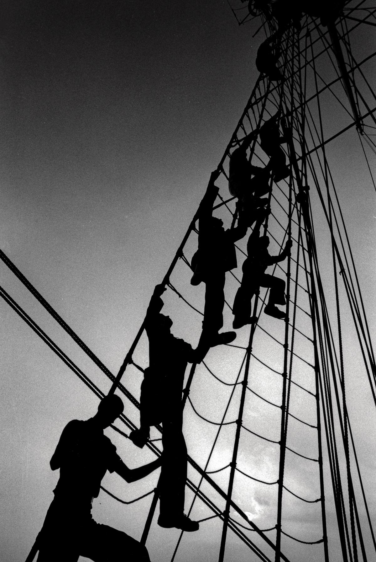 U.S. Coast Guard cadets scale a shroud on board the USCGC Eagle (WIX-327)
