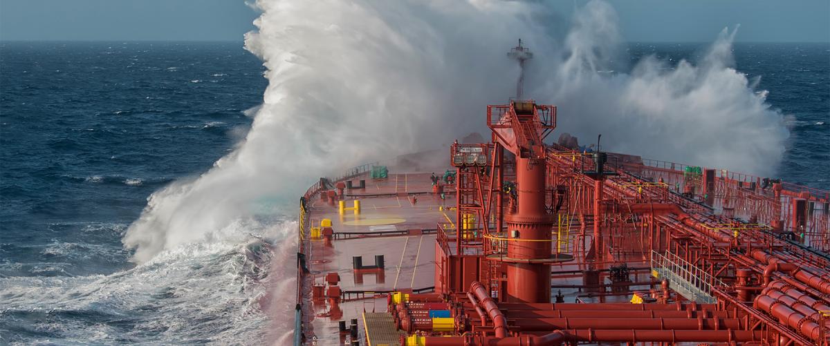 A wave breaks against a tanker ship. Knowing where Russia is engaged in illegal oil revenues is paramount to avoiding further illicit activities and preventing potential escalation of oil smuggling—and even possibly potential military maneuvers.