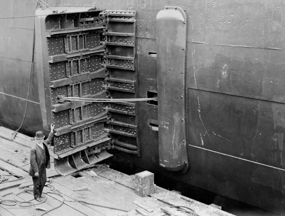 The Lacoste Ship Brake is shown, looking aft, installed on the USS Indiana (BB-1) at Philadelphia on 1 April 1910. The simple door configuration was complicated by the curvature of the battleship’s hull.