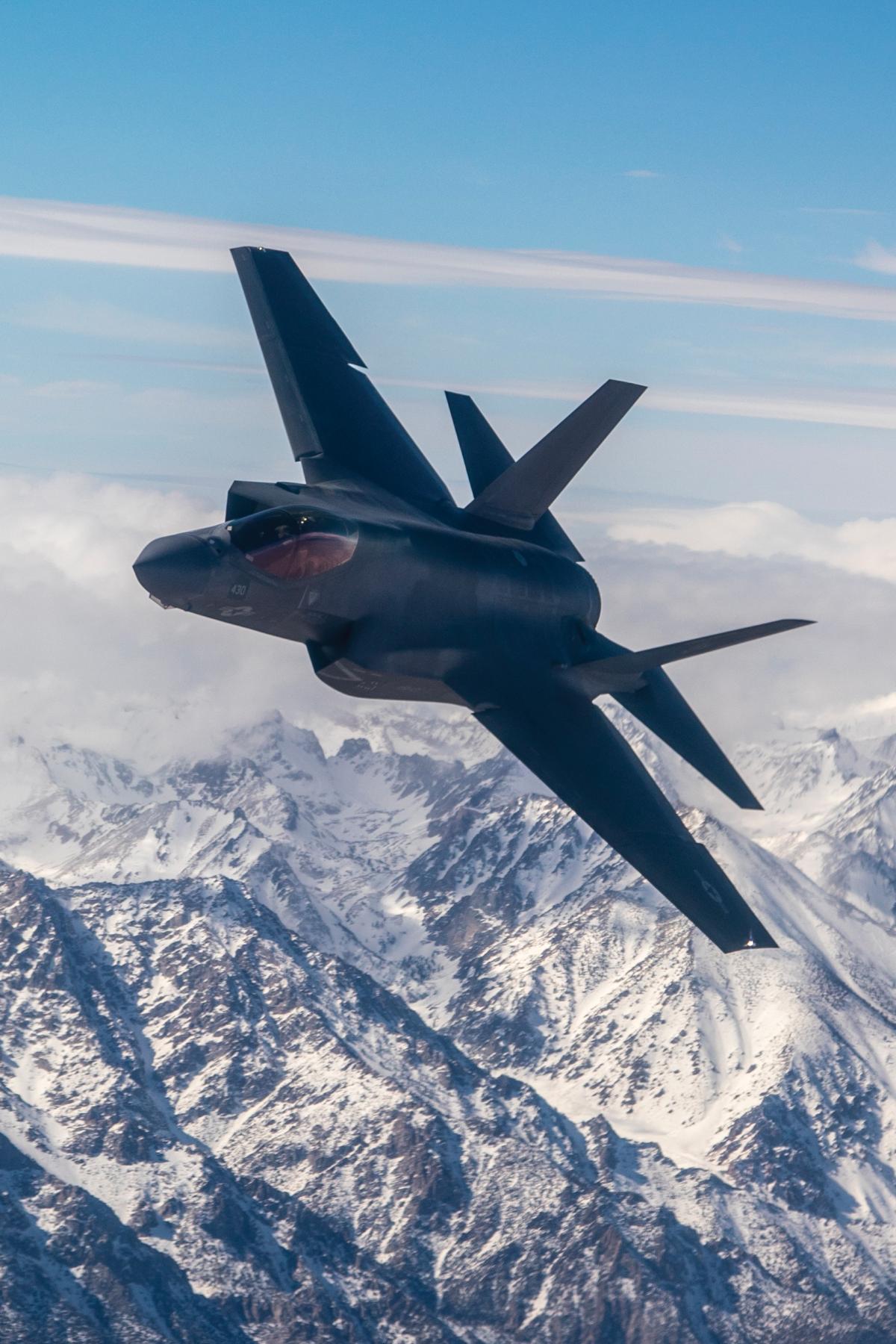 A Navy F-35C Lightning II from the “Rough Raiders” of Strike Fighter Squadron (VFA) 125 soars over the Sierra Nevada Mountain Range