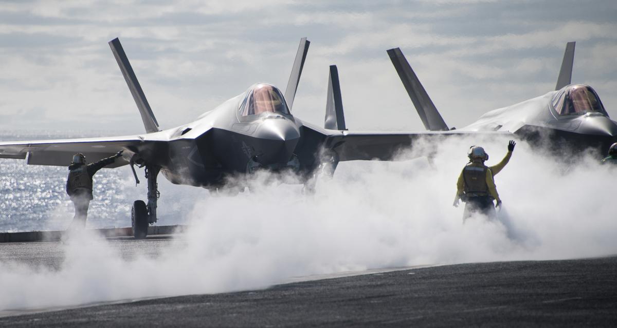 Sailors directing an F-35C Lightning II multirole fighter aircraft assigned to the “Argonauts” of Strike Fighter Squadron (VFA) 147 on the flight deck of the aircraft carrier USS Carl Vinson (CVN-70) in December 2018.