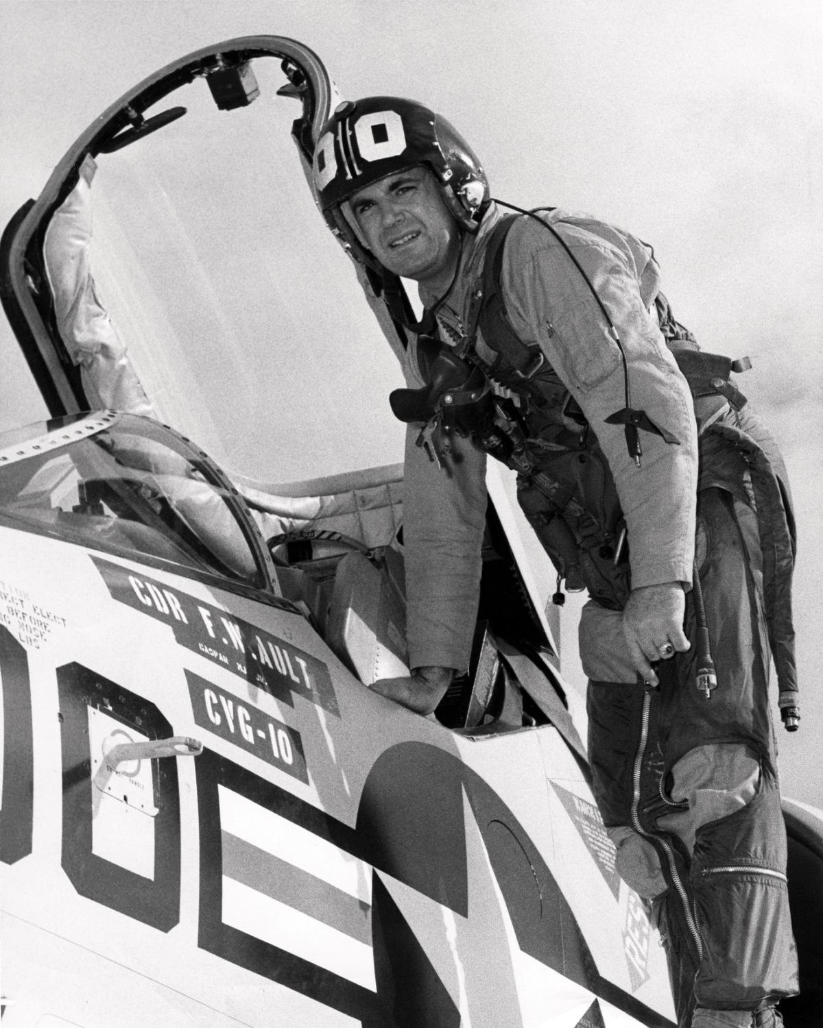 Captain Frank Ault climbing out of a cockput