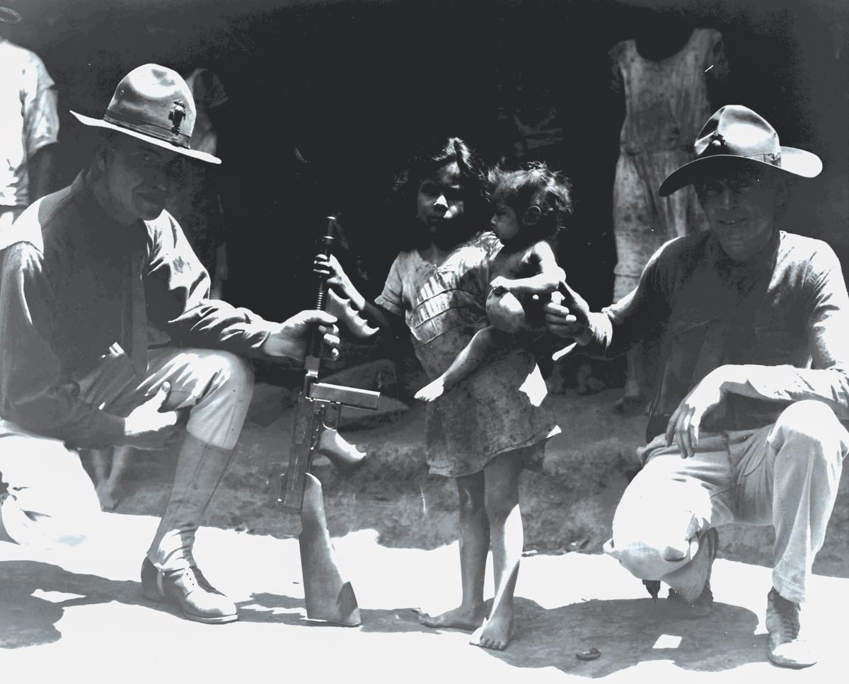 U.S. Marines posing with Nicuraguan children