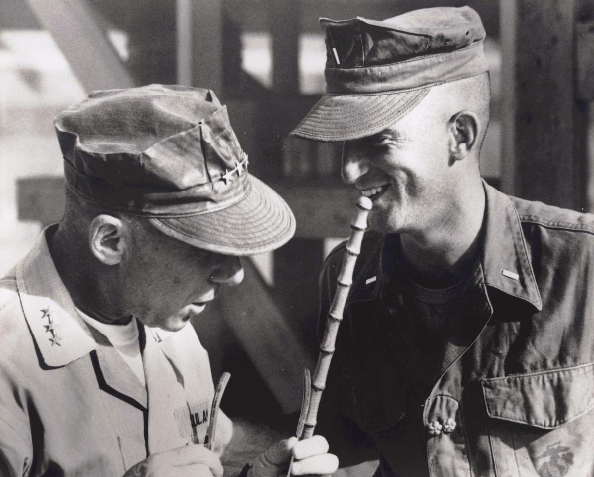 Lieutenant General Victor Krulak, left, with his son, the future Commandant of the Marine Corps Charles Krulak as a young officer in an undated photograph.