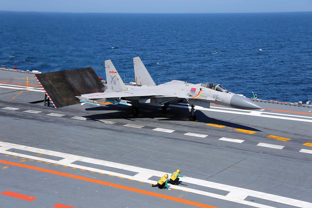A J-15 Flying Shark fighter prepares for launch from the Liaoning.