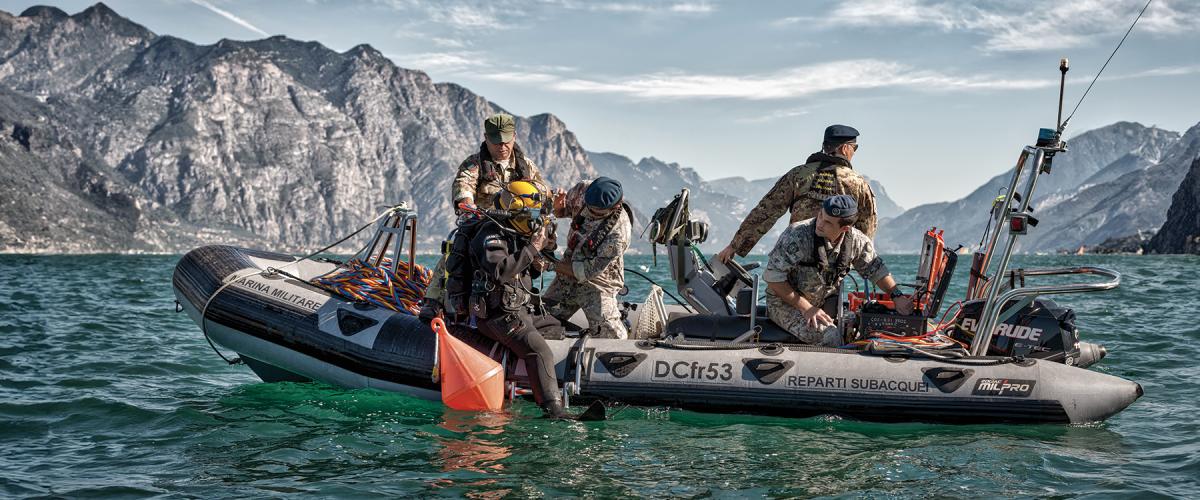 Italian Navy Underwater Operations Group personnel conduct reclamation operations.