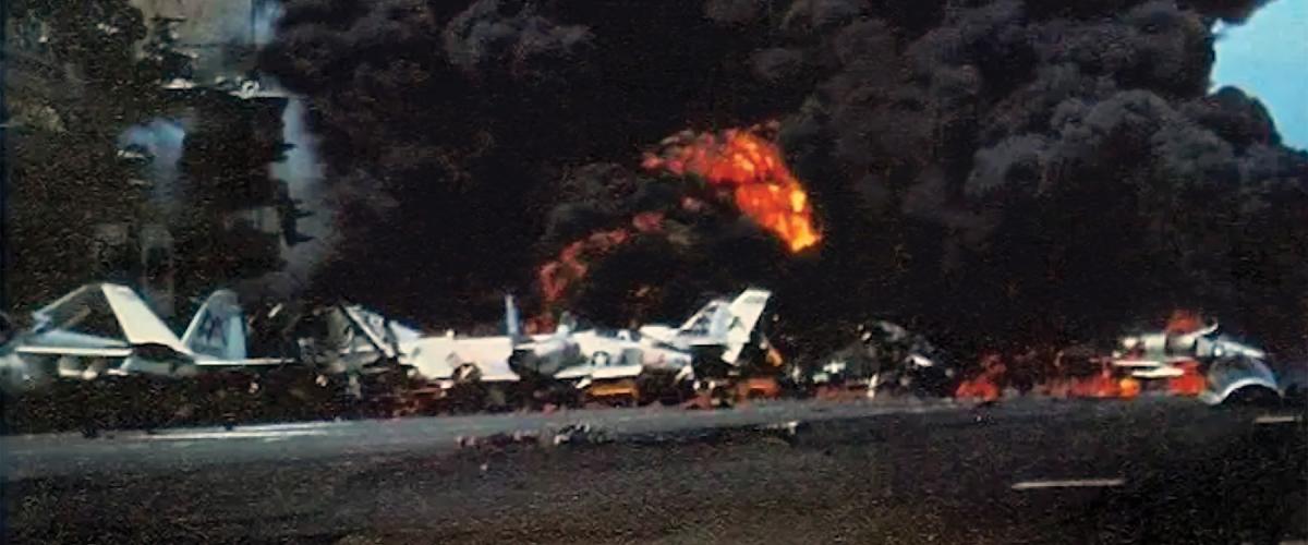 USS Forrestal is engulfed in explosions
