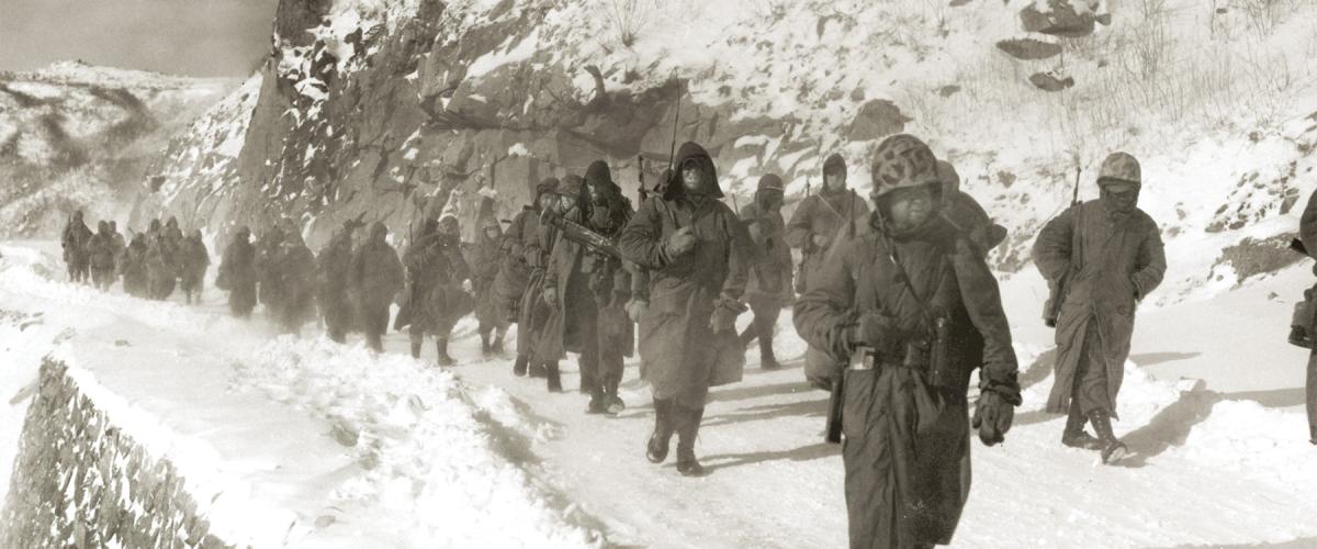 9 December 1950: Marines of the 1st Marine Division march through  mountain terrain in subzero weather during the Korean War’s Battle of Chosin Reservoir—one of the deadliest of the war.
