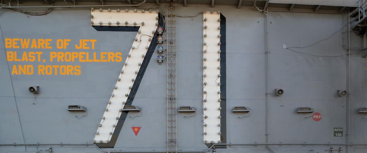 The warning painted on the superstructure of every aircraft carrier and amphibious assault ship above the flight deck—one of the most unforgiving working environments in the world.