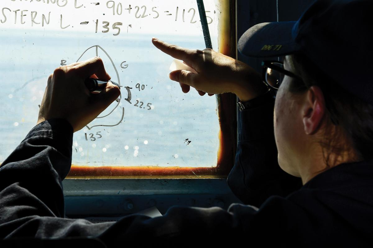 Navy ensign conducts rules of the road training.