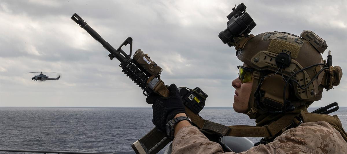 A U.S. Marine with maritime raid force, 31st Marine Expeditionary Unit posts security during a visit, board, search, and seizure exercise aboard the USS Miguel Keith (ESB-5) off the coast of Okinawa, Japan, in February 2023. Force selection, interception tactics, and the correct employment of maritime geography are critical elements of a blockade’s conduct.