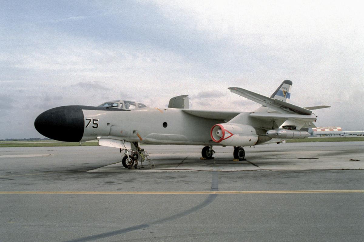 NRA-3B Skywarrior aircraft equipped with electronic warfare (jammer) pods, with its wing folded up at the Pacific Missile Test Center.
