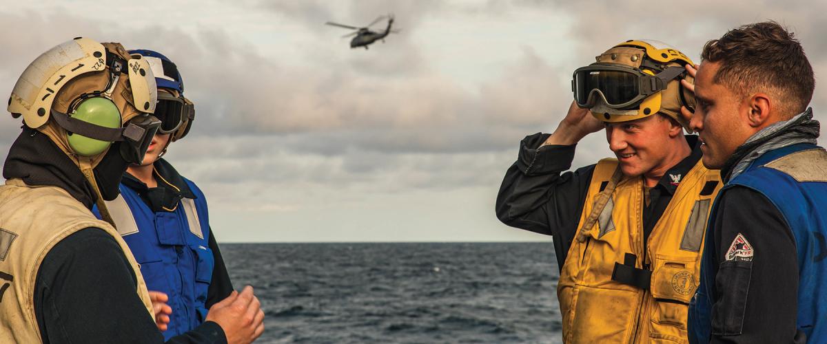 Sailors on the flight deck of the USS Paul Ignatius (DDG-117)